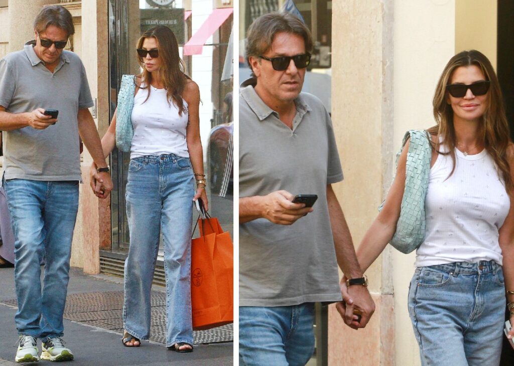 Claudia Galanti nonostante il caldo porta il compagno a fare shopping di lusso in centro a Milano: foto con la busta Hermès nel quadrilatero della moda